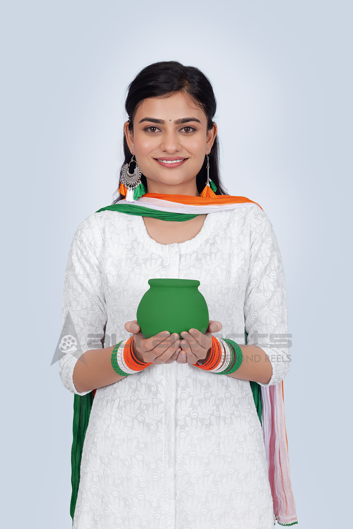 Indian woman holding traditional earthen pot