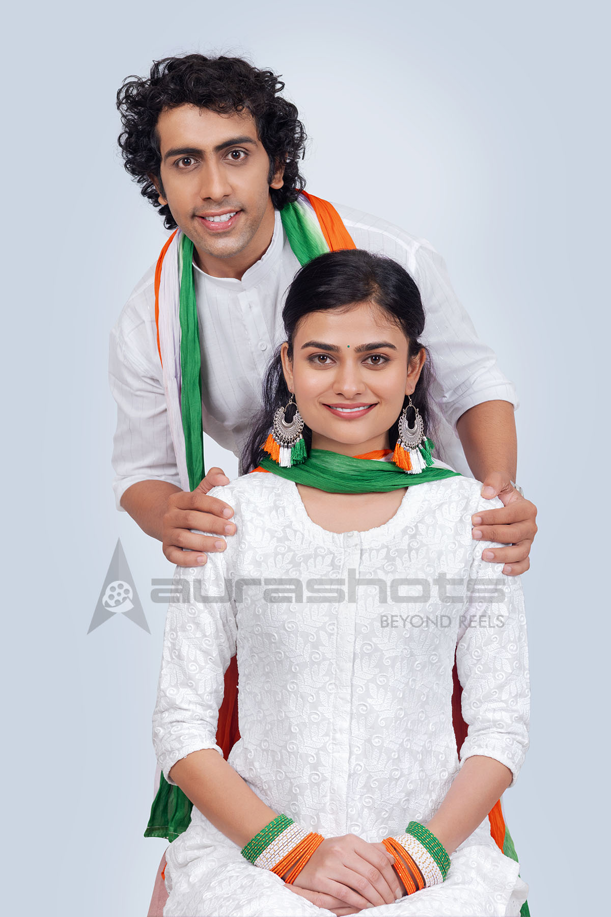 Indian couple in tricolor attire posing together