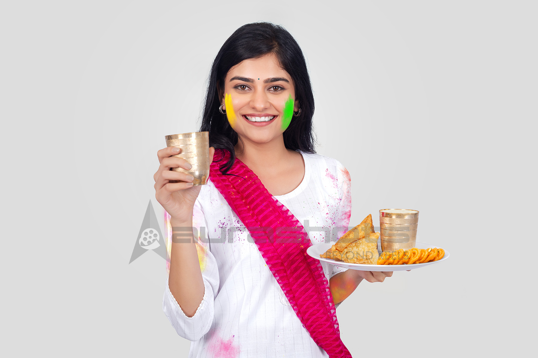 Indian woman enjoying samosa with lassi
