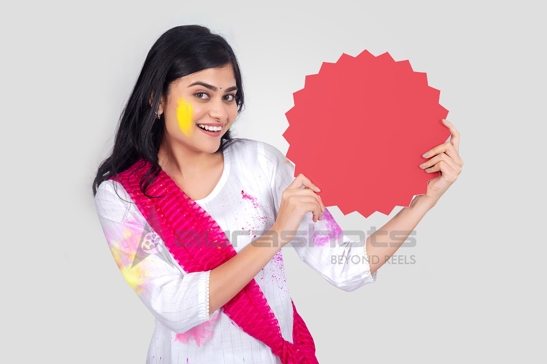 Smiling Indian woman holding offer cutout