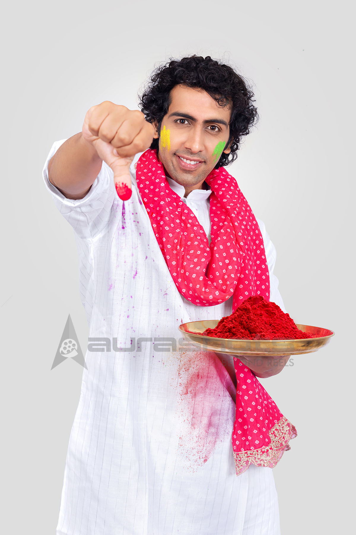 Indian Man applying a tilak for a festive tradition