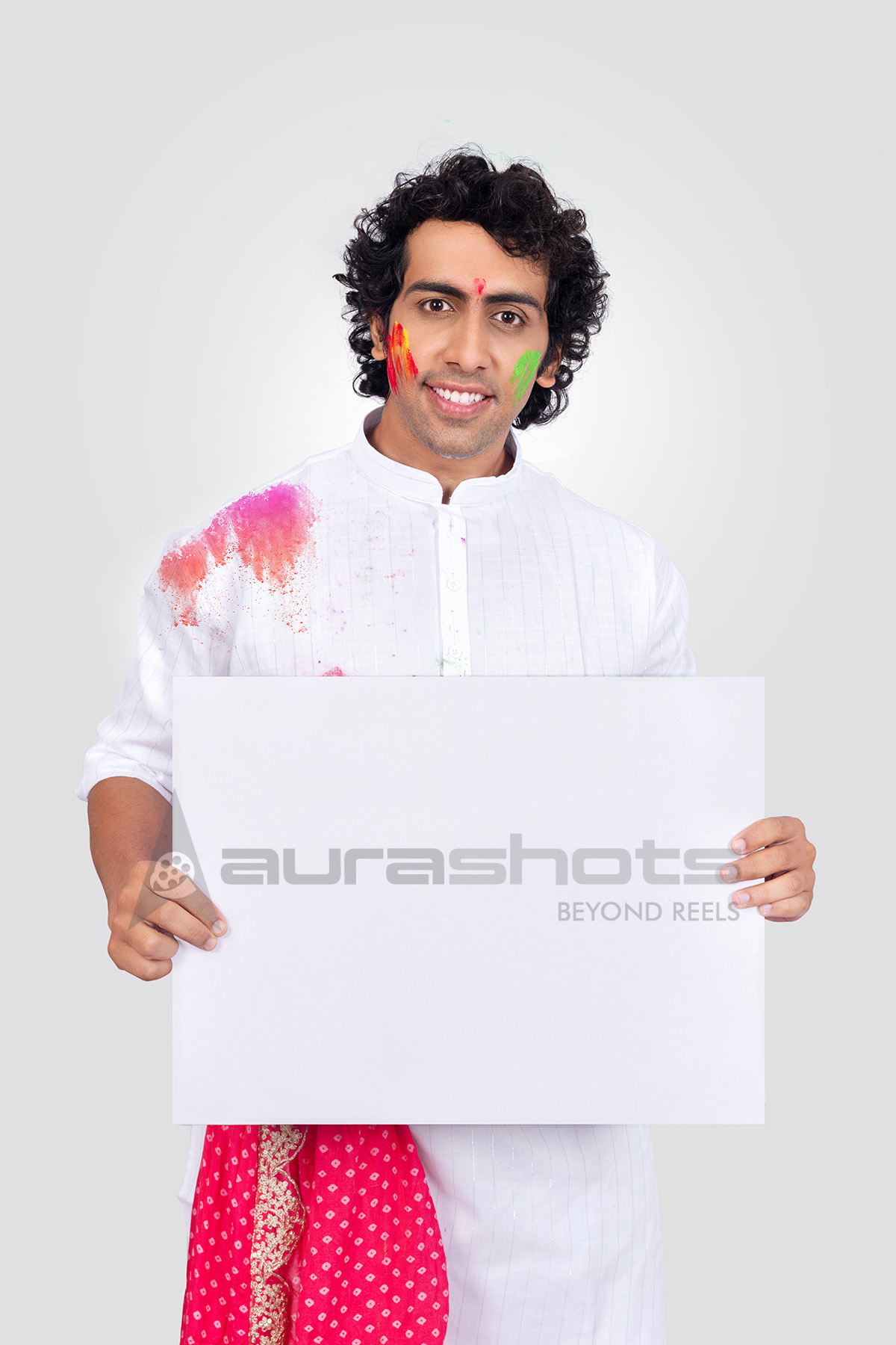 Man holding a offer board for Holi message