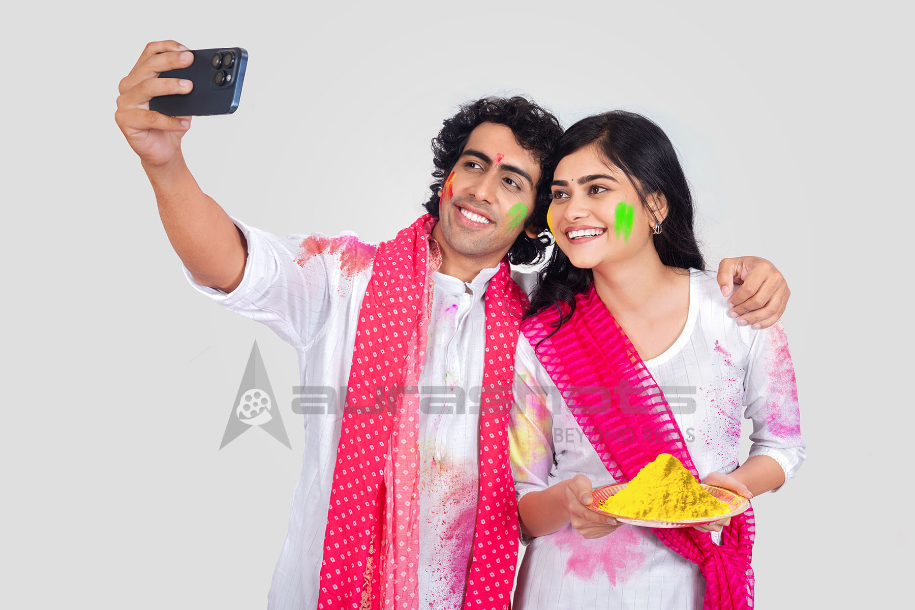 Couple taking selfie during Holi celebration
