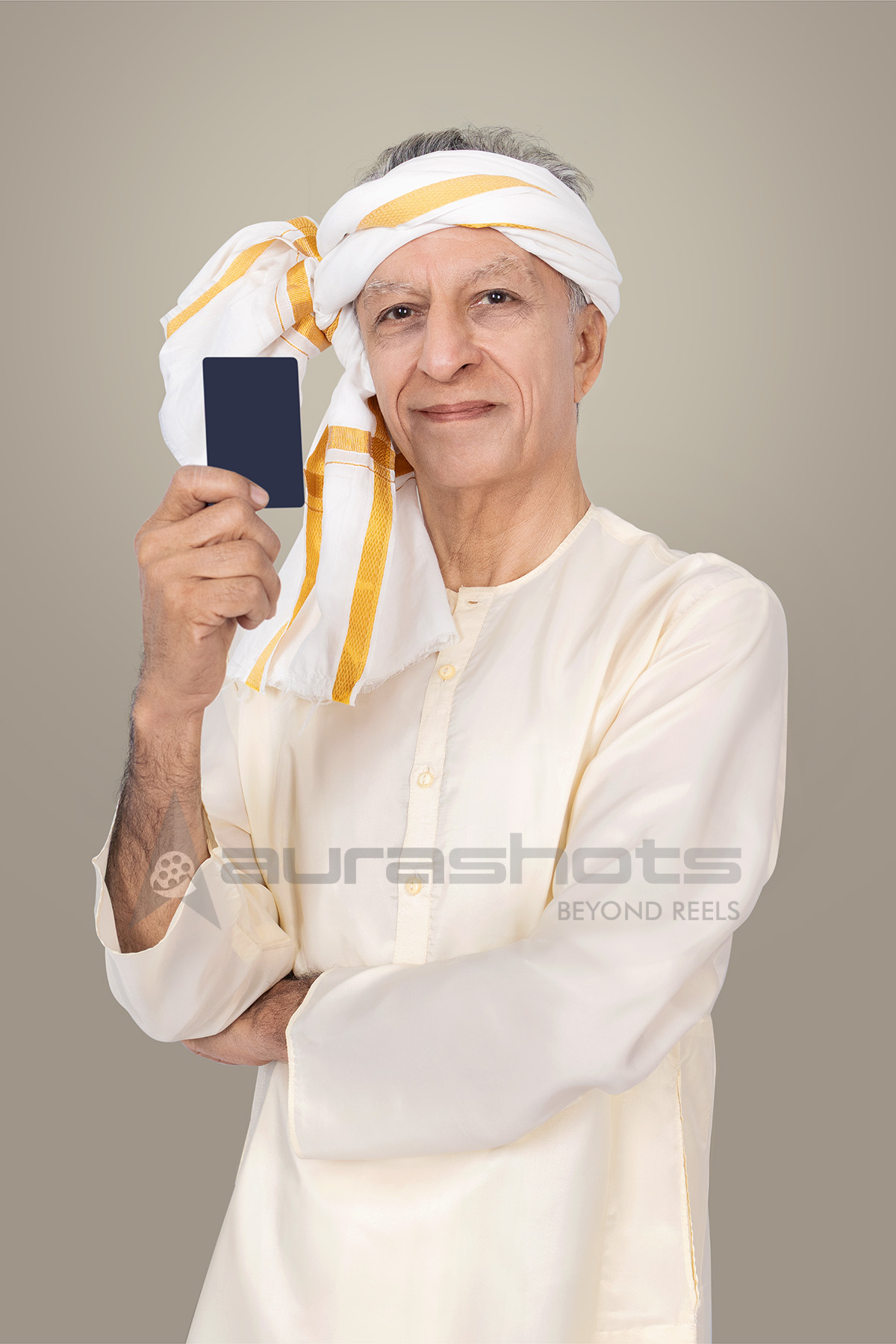 Elderly rural man holding bank card