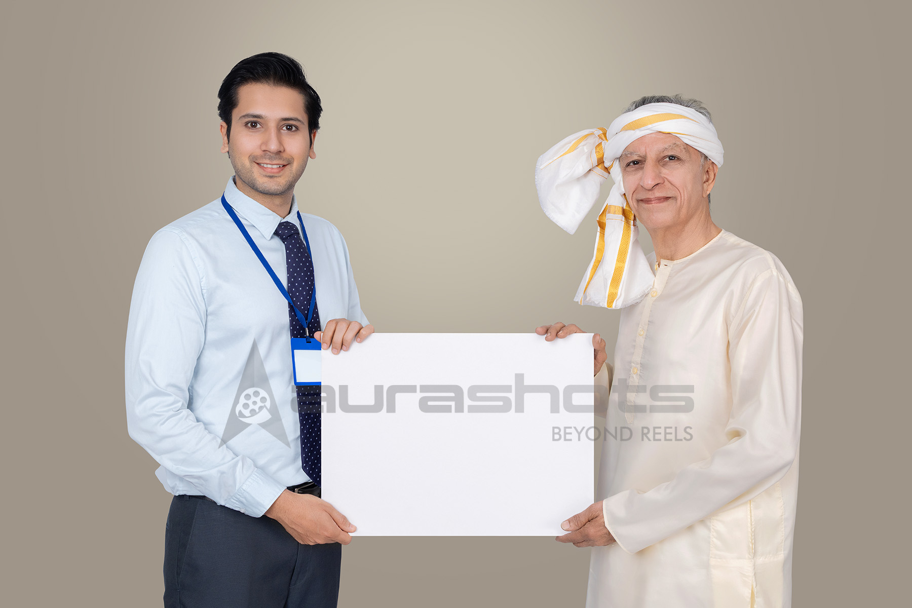Young banker with rural Indian senior holding board for financial services