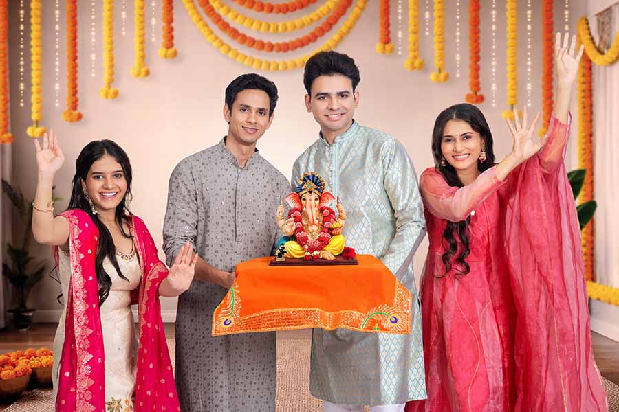 Family greeting and celebrating ganesh puja festival together