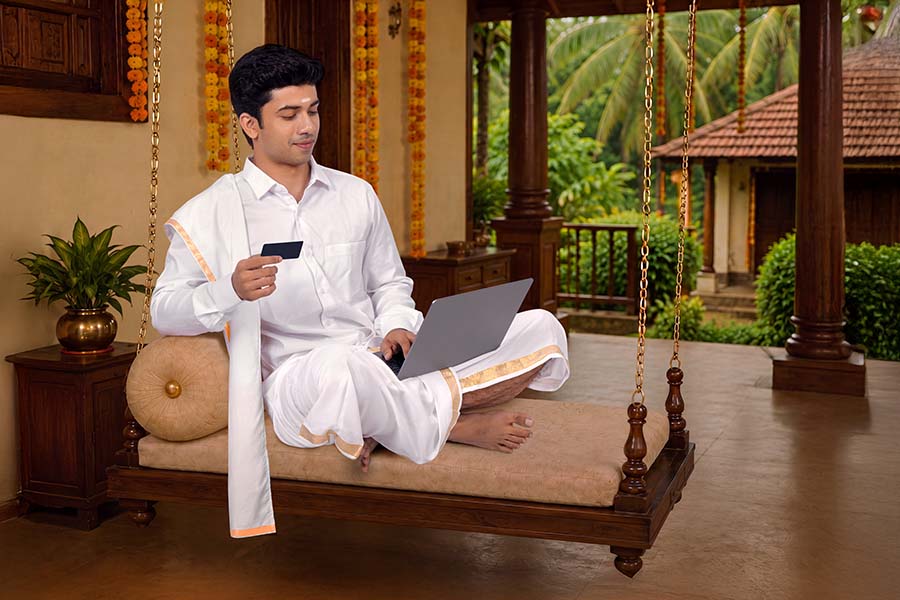 Kerala man making secure online payment during Onam celebration