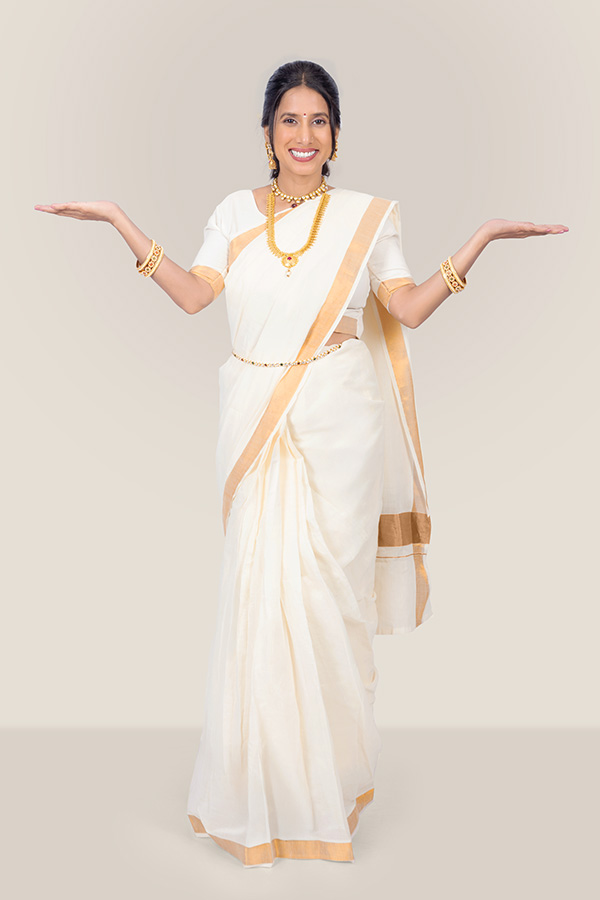 Smiling Indian woman presenting empty hands for product placement