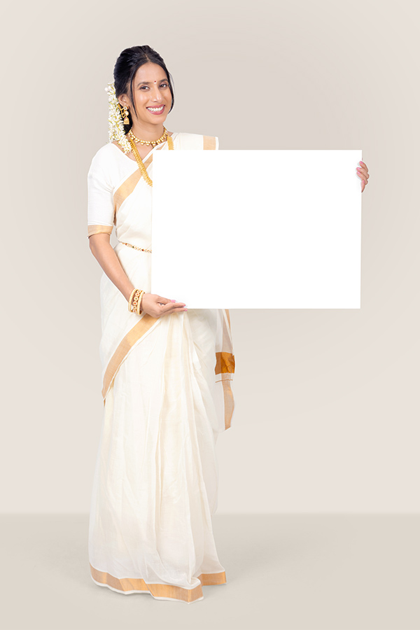 Indian woman holding blank white signboard for Onam promotion