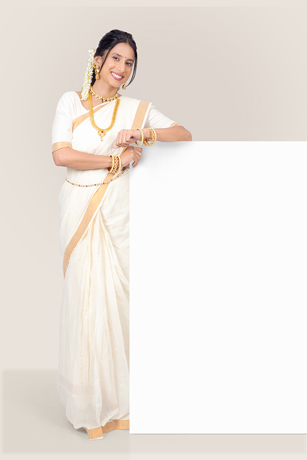 Indian woman leaning on blank display board for festive advertising