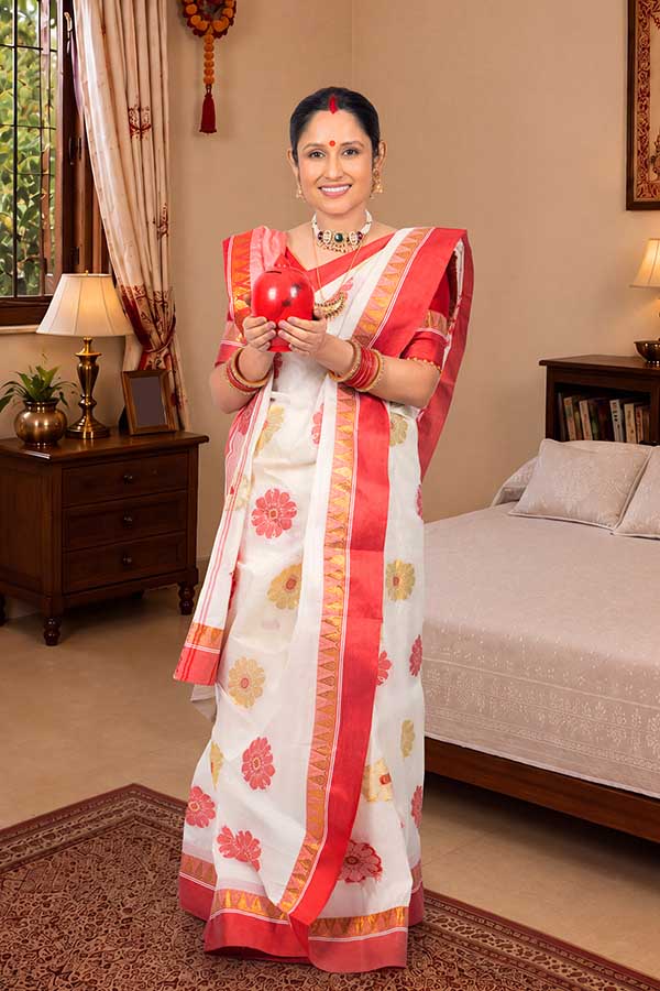 Indian woman holding traditional gullak for savings and financial planning