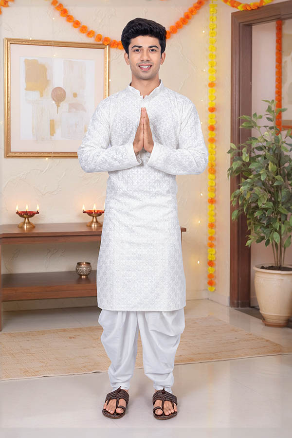 Young Indian man greeting with namaste during festival celebration
