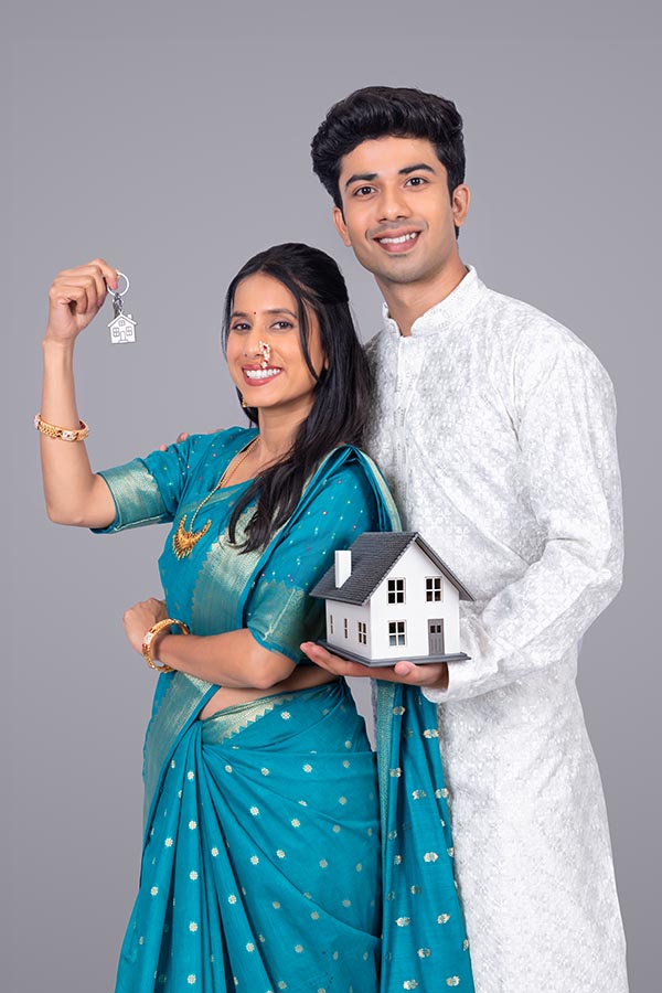 Young Indian man presenting smartphone screen for mobile app promotion