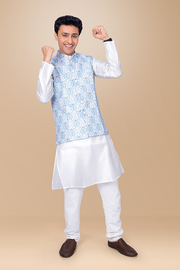 Happy Indian man expressing festive victory in ethnic clothing