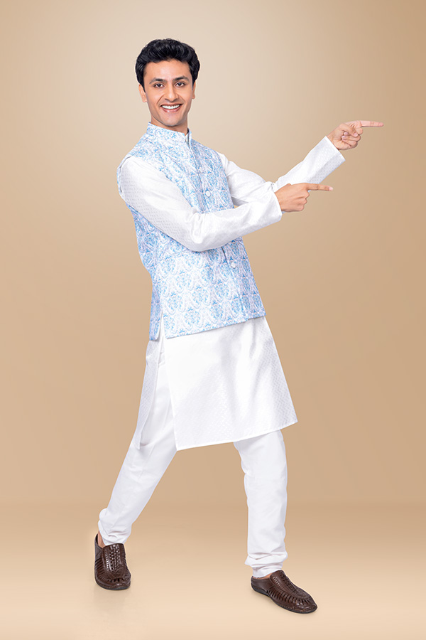 Indian man pointing with both hands for promotional display