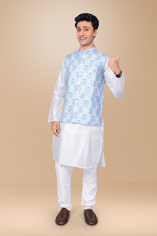 Young Indian man giving thumbs up in traditional festive wear