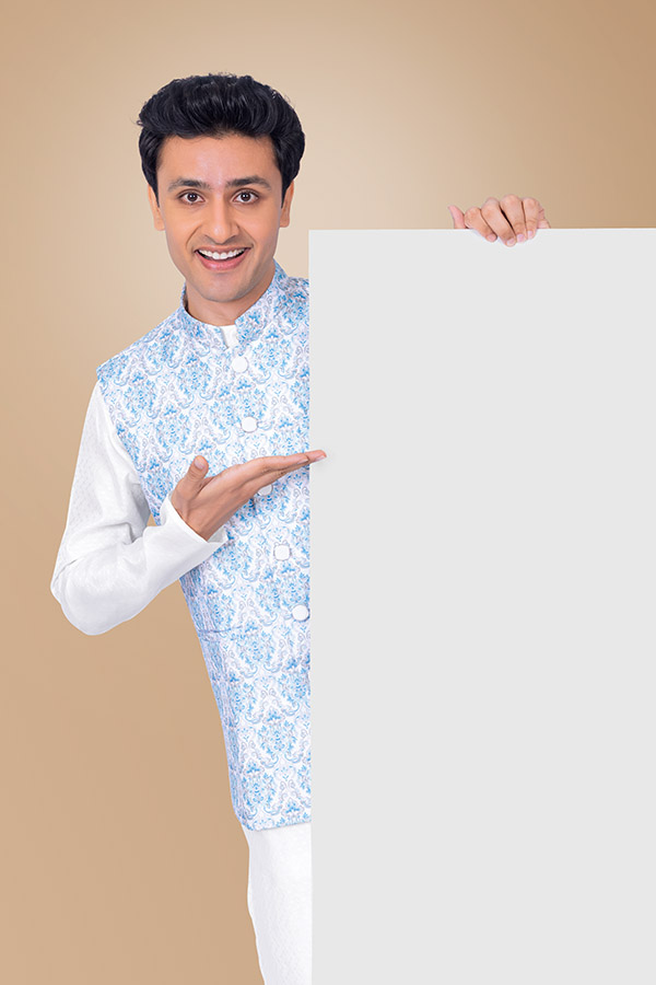 Indian man presenting empty display board for festive campaigns
