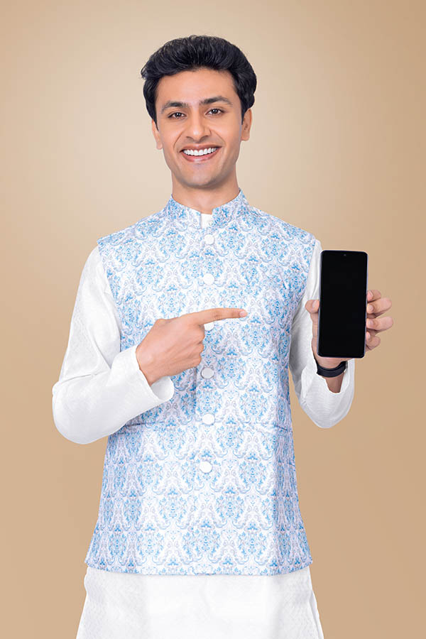 Young Indian man displaying smartphone for festive mobile campaign
