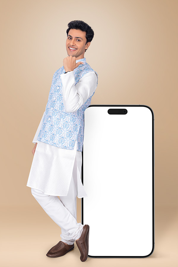 Confident Indian man posing beside blank mobile screen for festive promotion