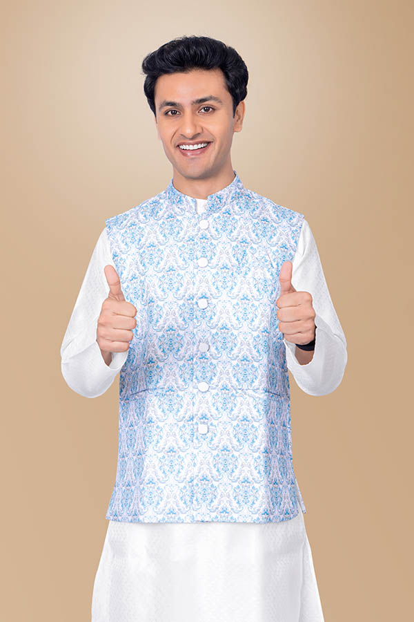 Happy Indian man showing thumbs up in traditional festive attire