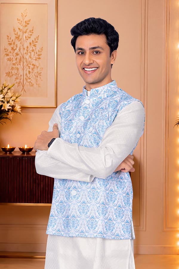 Confident Indian man in festive ethnic wear with folded arms