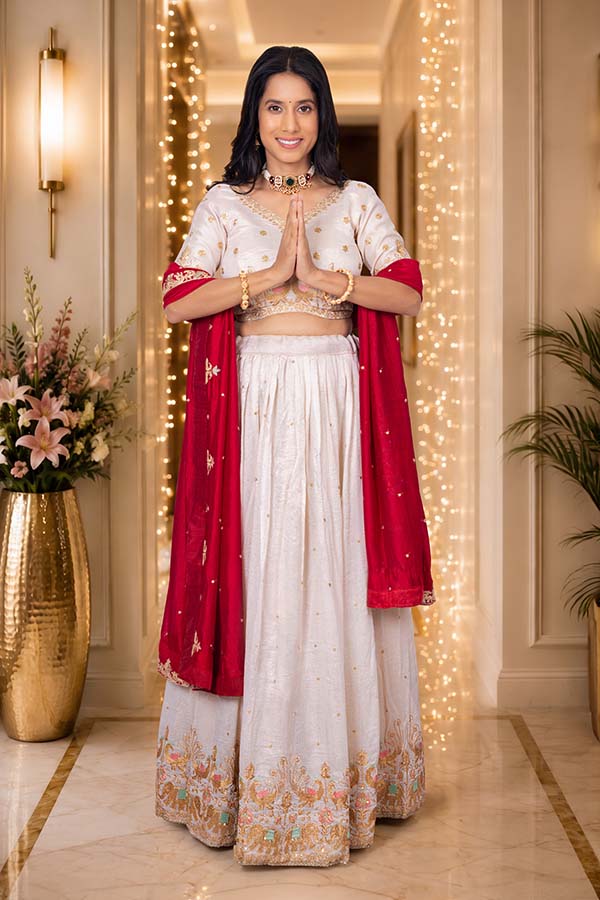 Indian woman greeting with namaste during Diwali celebration