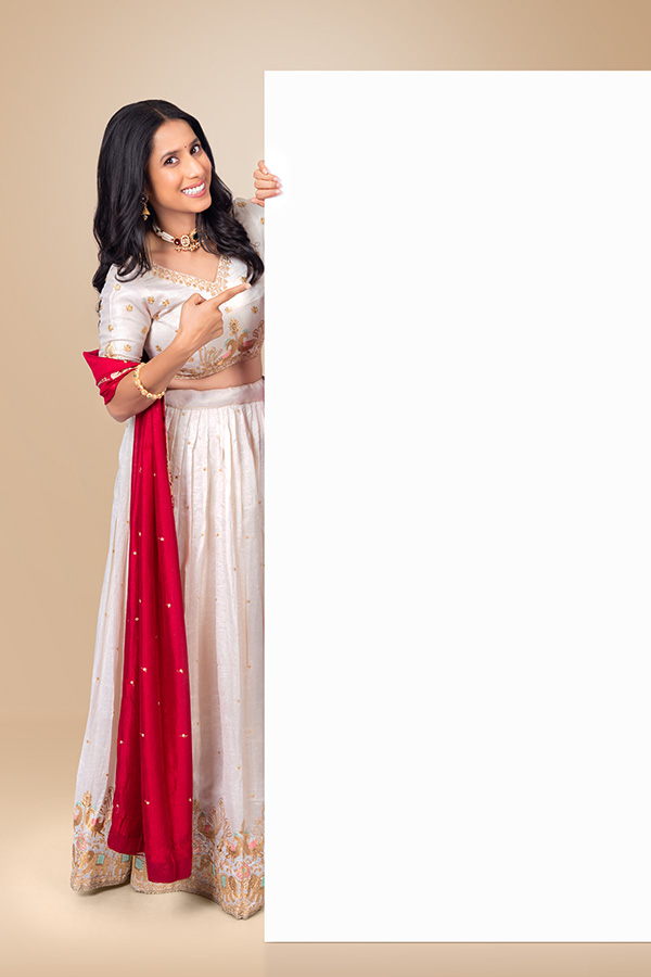 Indian woman holding blank white display board for advertisement