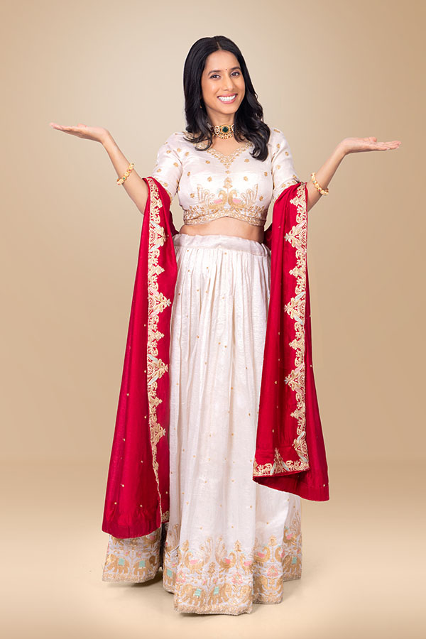 Indian woman balancing presentation with both open palms