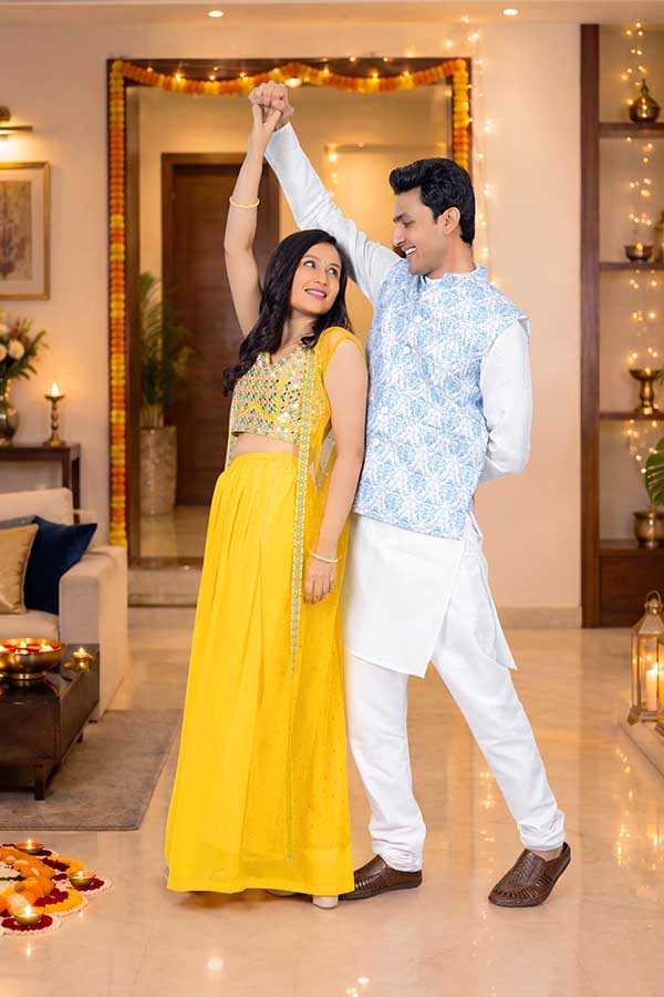 Indian couple dancing romantically during Diwali festival celebration