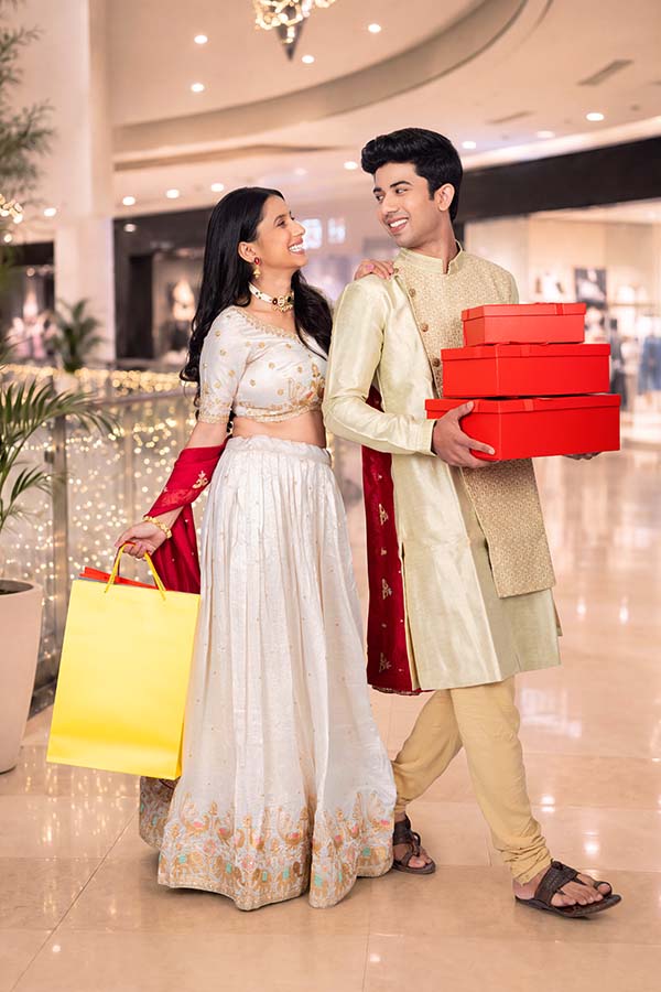 Indian couple shopping together at mall during festive season