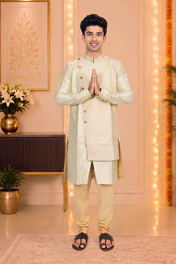 Young Indian man greeting with namaste during festival celebration at home