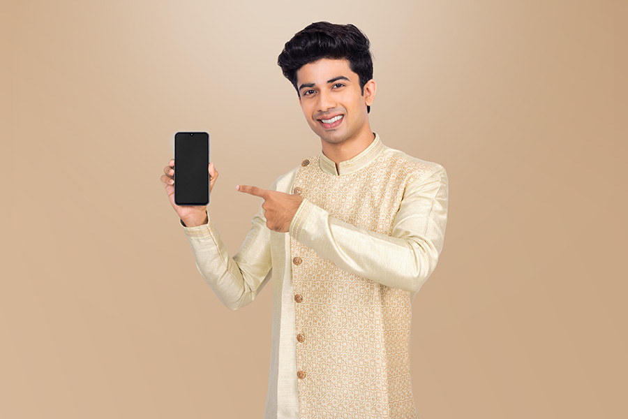 Indian man presenting smartphone screen for mobile app promotion