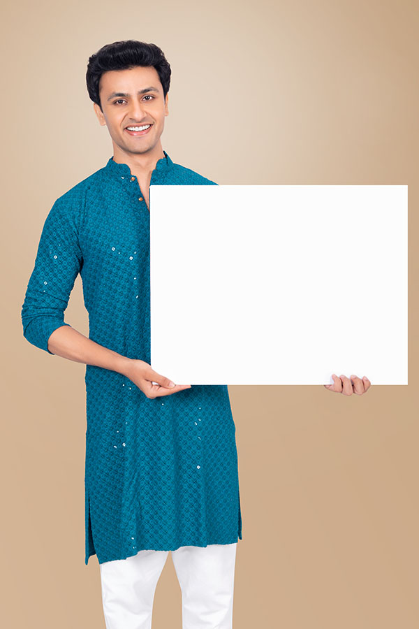 Smiling Indian man holding blank placard for festive promotion