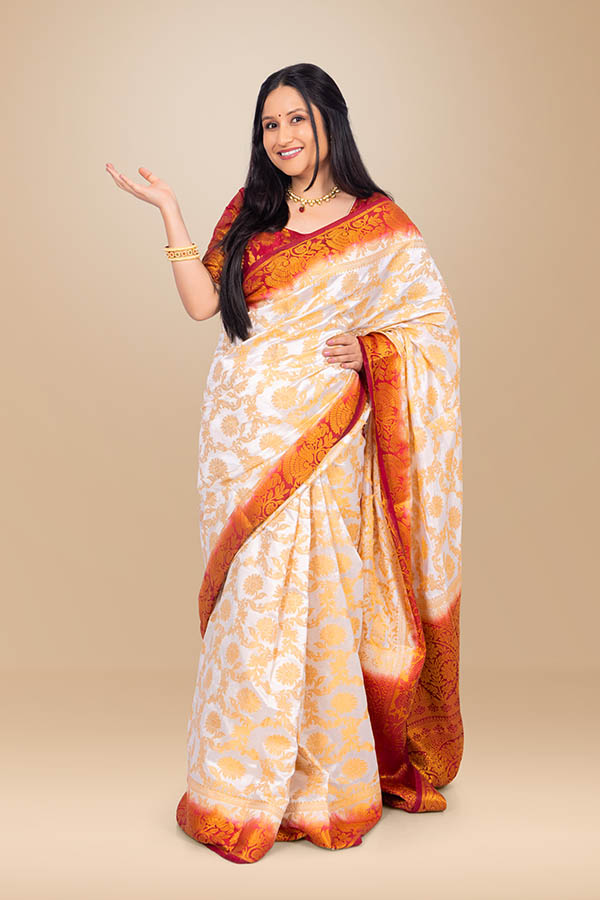 Elegant Indian woman welcoming festive celebrations in traditional silk saree