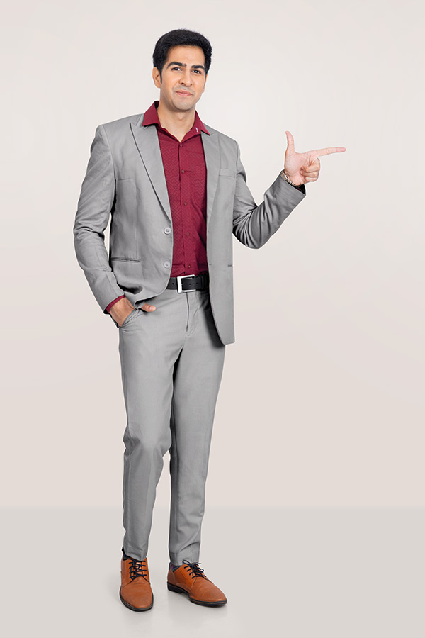 Indian businessman in formal suit pointing for business presentation