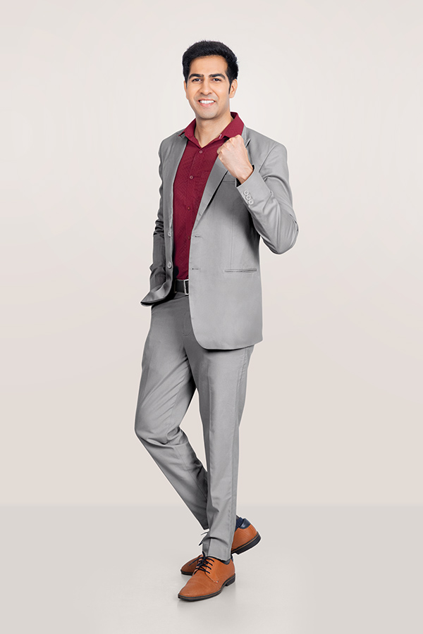 Indian businessman posing confidently in formal suit