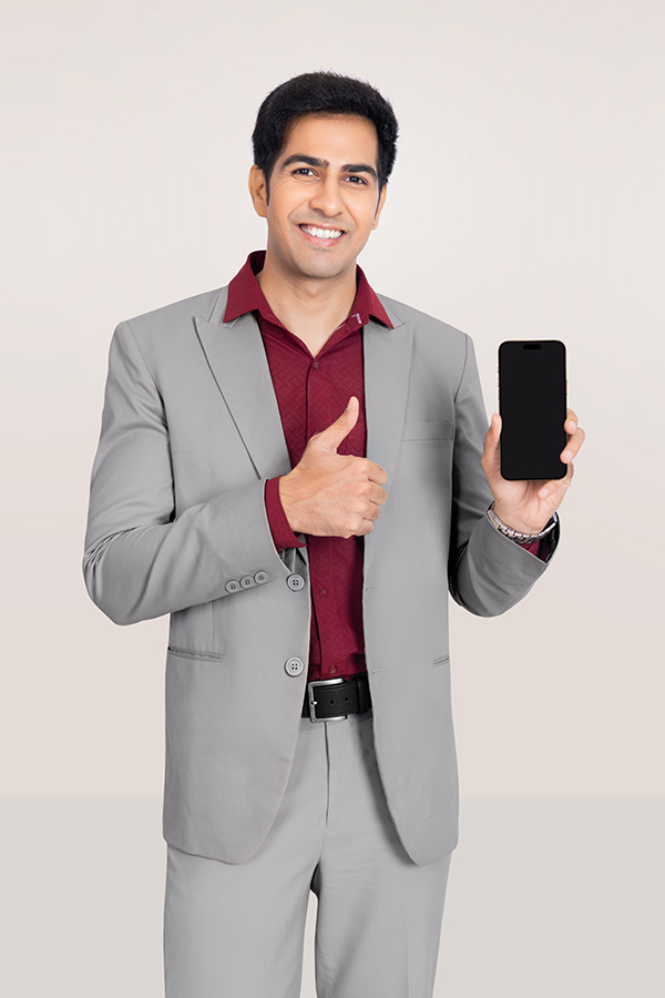 Indian businessman holding smartphone with thumbs up