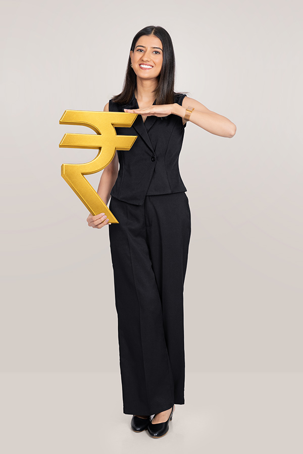 Indian businesswoman holding golden rupee symbol for finance concept