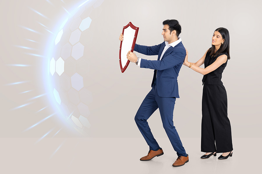 Indian business professionals using shield for cybersecurity protection concept