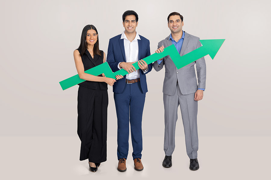 Indian business team holding upward arrow for growth and success concept
