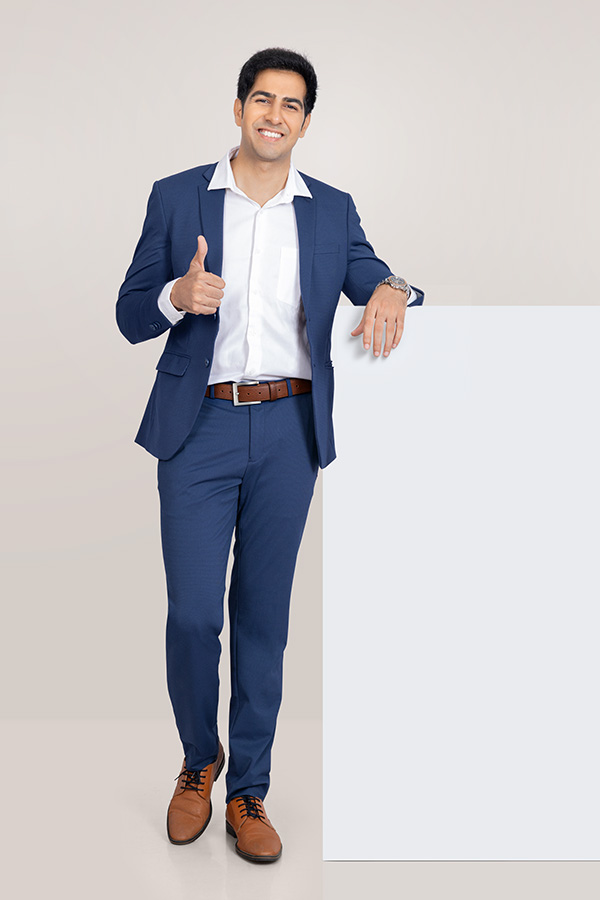Indian businessman presenting blank board with positive gesture for advertising