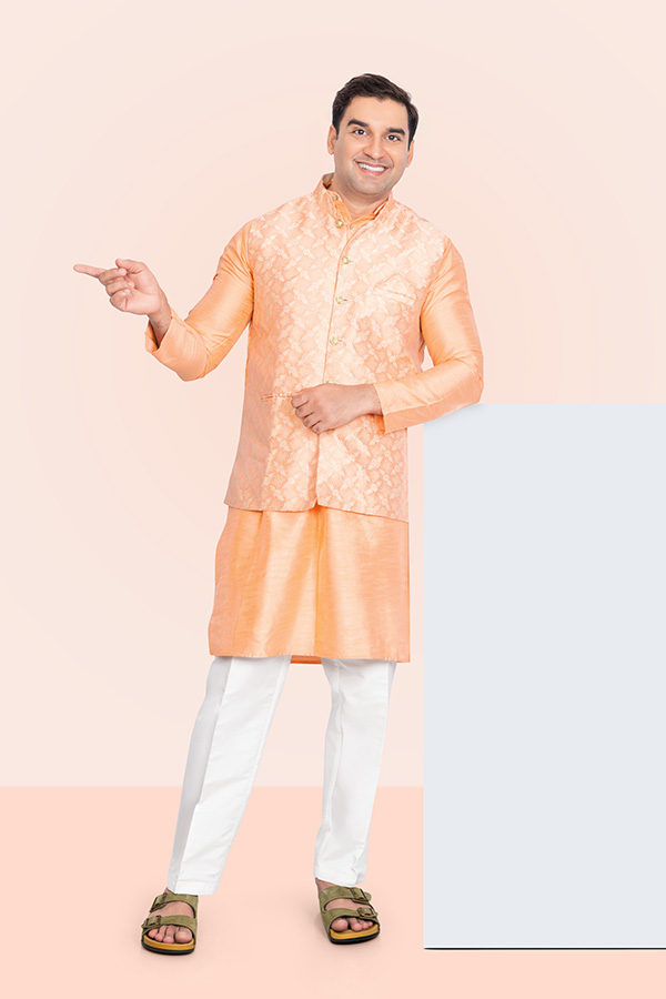 Indian man pointing beside a blank vertical advertising panel